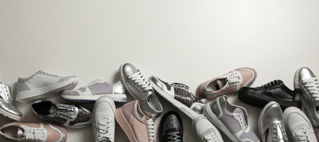 Flat lay composition with stylish shoes on light background. Space for textの写真素材