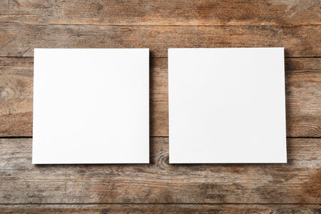Blank paper sheets for brochure on wooden background, flat lay. Mock upの写真素材