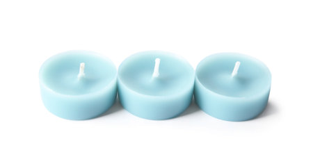 Light blue wax decorative candles isolated on whiteの写真素材