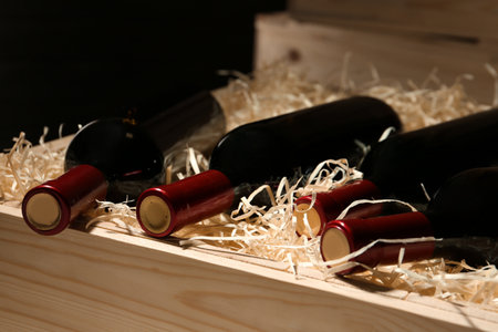 Wooden crate with bottles of wine, closeupの写真素材