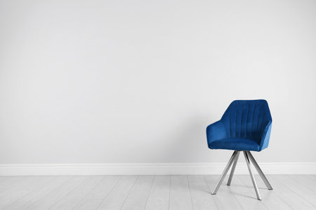 Blue modern chair for interior design on wooden floor at white wallの写真素材