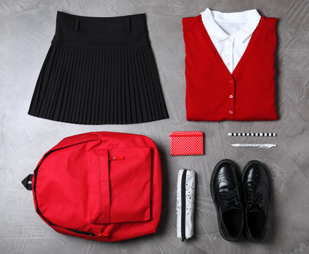 Flat lay composition with school uniform on grey stone backgroundの写真素材