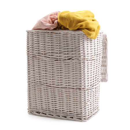 Laundry basket with dirty clothes isolated on whiteの写真素材