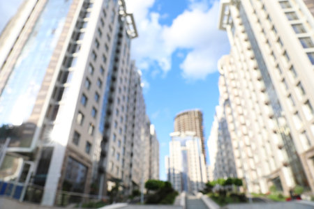 Blurred view of modern buildings in city