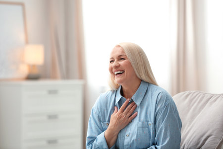 Portrait of happy mature woman at home
