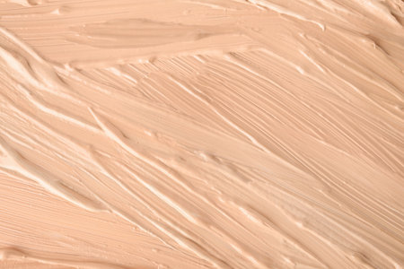 Samples of different foundation shades as background, top viewの写真素材
