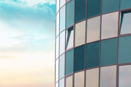Modern building with tinted windows against the sky. urban architecture