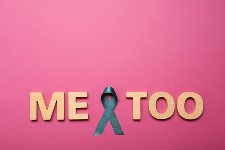 Phrase Me Too made of wooden letters and teal awareness ribbon on pink background, top view. Stop sexual assaultの写真素材