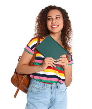 Beautiful African-American woman with book on white background. Reading timeの写真素材