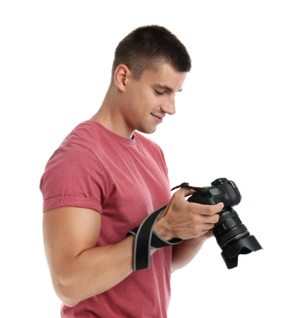Young photographer with professional camera on white backgroundの写真素材