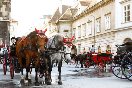 VIENNA, AUSTRIA - APRIL 26, 2019: Horse drawn carriages on city streetのeditorial素材