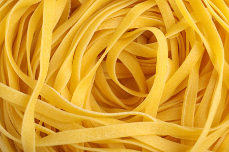 Tasty raw egg noodles as background, top viewの写真素材