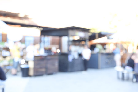 Blurred view of modern open air cafe on sunny day. bokeh effectの写真素材