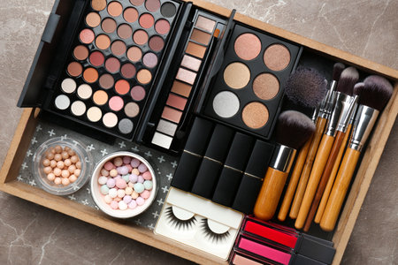 Set of different professional makeup products in box on table, top viewの写真素材