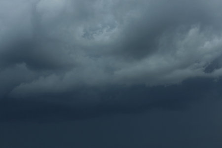 Sky with heavy rainy clouds on gray day