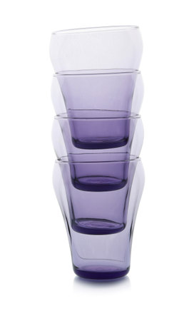 Stack of empty colorful glasses on white backgroundの写真素材
