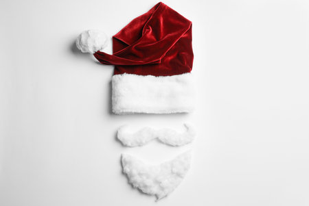 Santa Claus hat with beard on white background, top viewの写真素材