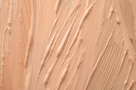 Samples of different foundation shades as background, top viewの写真素材