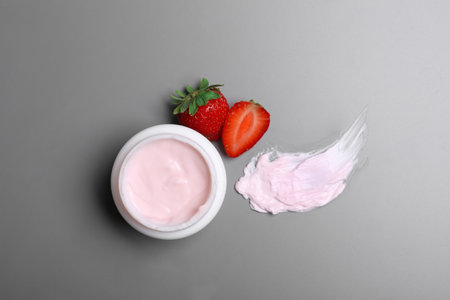 Flat lay composition with jar of body cream on gray backgroundの写真素材