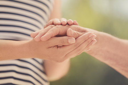 People, care and support. Giving helping hand conceptの写真素材