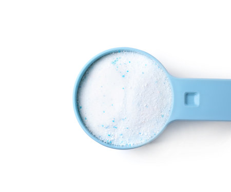 Measuring spoon with laundry powder isolated on white, top viewの写真素材