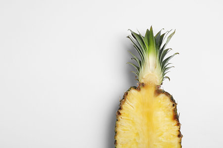Half of raw pineapple on white background, top viewの写真素材