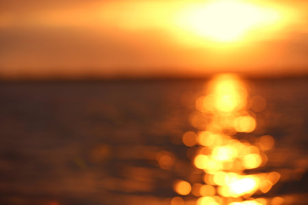 Blurred view of sea and sky at sunsetの写真素材