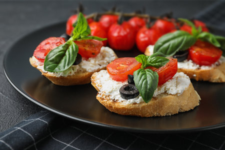 Plate of delicious tomato bruschettas on table, closeupの写真素材
