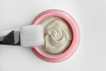 Professional face mask with brush on white background, top viewの写真素材