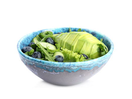 Delicious avocado salad with blueberries in bowl on white backgroundの写真素材