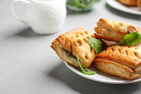 Fresh delicious puff pastry served on light table, closeupの写真素材