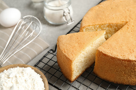 Delicious fresh homemade cake on gray marble table, closeup
