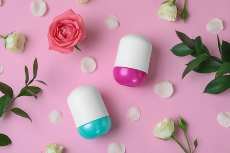 Flat lay composition with natural female roll-on deodorants on pink backgroundの写真素材