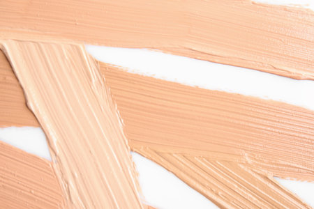 Samples of different foundation shades on white background, top viewの写真素材