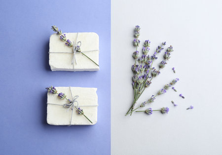 Hand made soap bars with lavender flowers on color background, flat layの写真素材