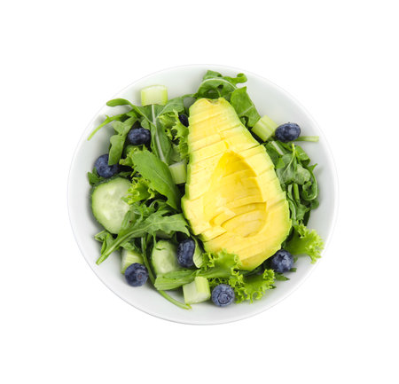 Delicious avocado salad with blueberries in bowl on white background, top viewの写真素材