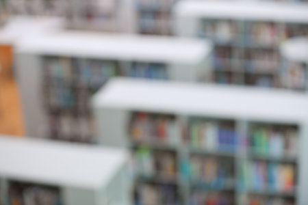 Blurred view of shelving units with books in library