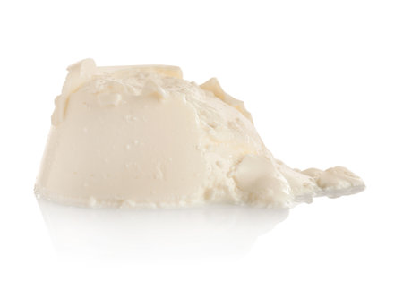 Tasty creamy feta cheese on white backgroundの写真素材