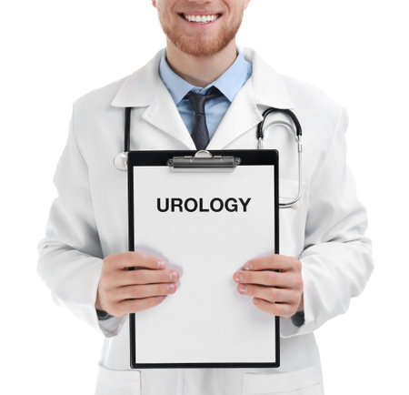 Male doctor holding clipboard with word UROLOGY on white background, closeupの写真素材