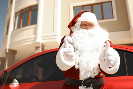 Authentic Santa Claus near modern car outdoorsの写真素材