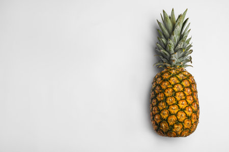 Tasty whole pineapple with leaves on white background, top viewの写真素材