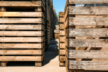 Old empty wooden crates outdoors on sunny dayの写真素材