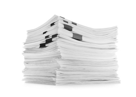 Stack of documents with black clips on white background