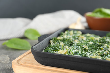 Tasty spinach dip on table, closeup viewの写真素材