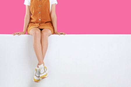 Woman wearing stylish shoes on color background, closeupの写真素材