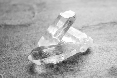 Beautiful rock crystal gemstones on gray tableの写真素材