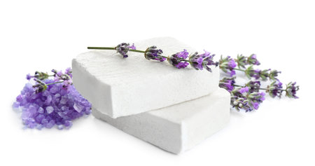 Hand made soap bars with lavender flowers and bath salt on white backgroundの写真素材