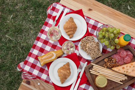 Picnic table with different tasty snacks, top viewの写真素材