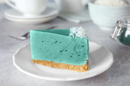 Piece of tasty spirulina cheesecake on gray table, closeup viewの写真素材