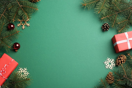 Frame made of Christmas decorations on green background, top view with space for text. winter seasonの写真素材